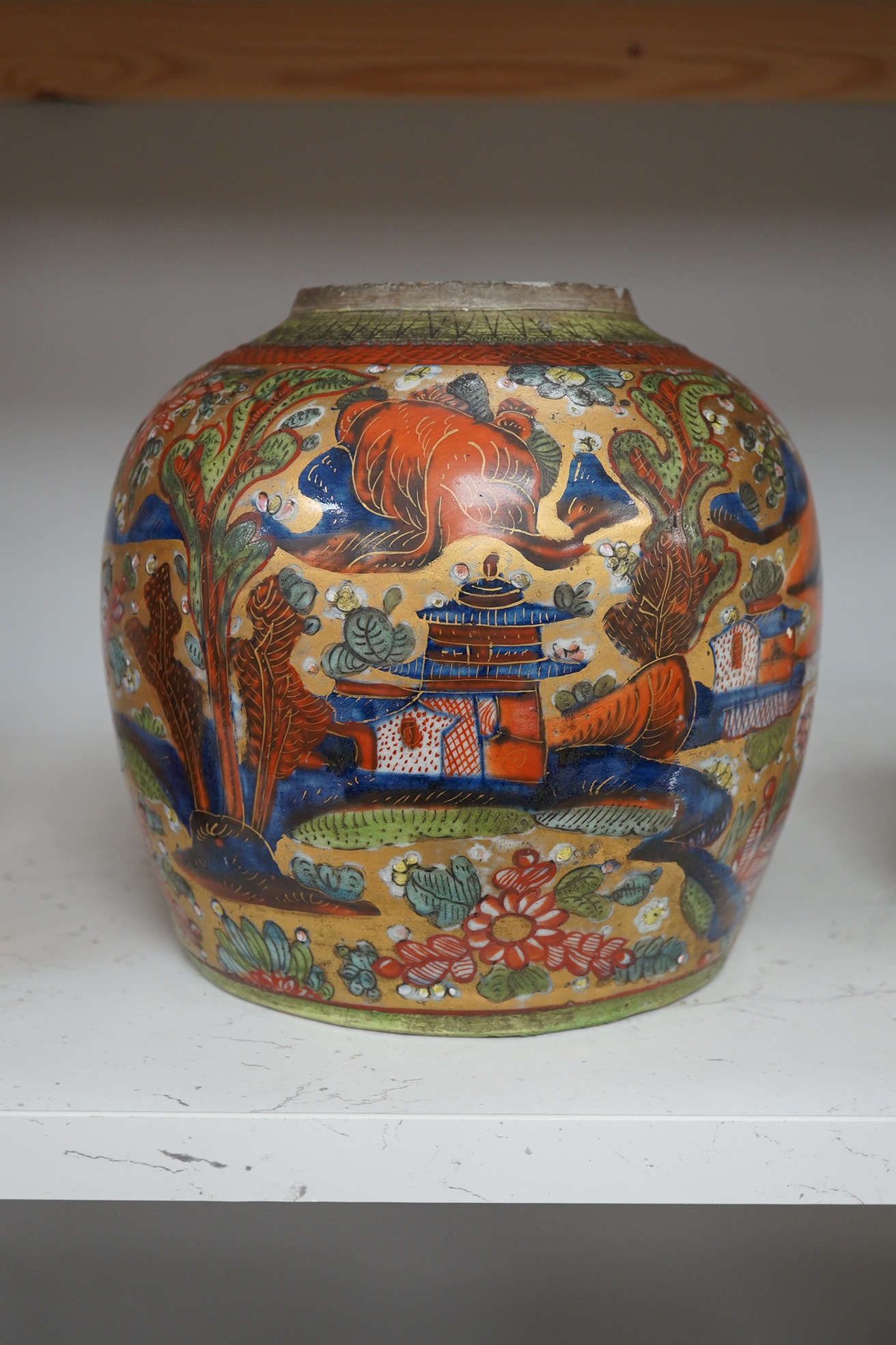 A Chinese porcelain clobbered ginger jar, with gold ground and dragon decoration, 20cm high. Condition - fair, minor wear /damage and a hole drilled near the rim